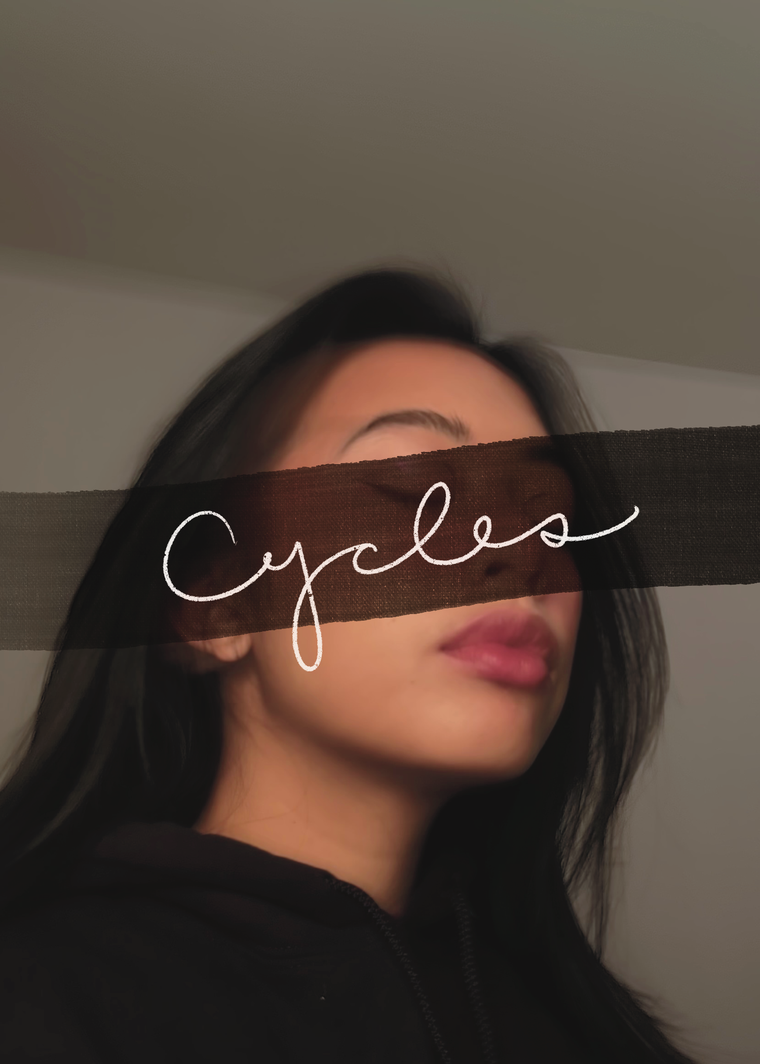 A book cover with a filipino-american girl with her eyes closed. She is wearing all black. Her hair is black. The title of the book, Cycles, is covering her eyes.