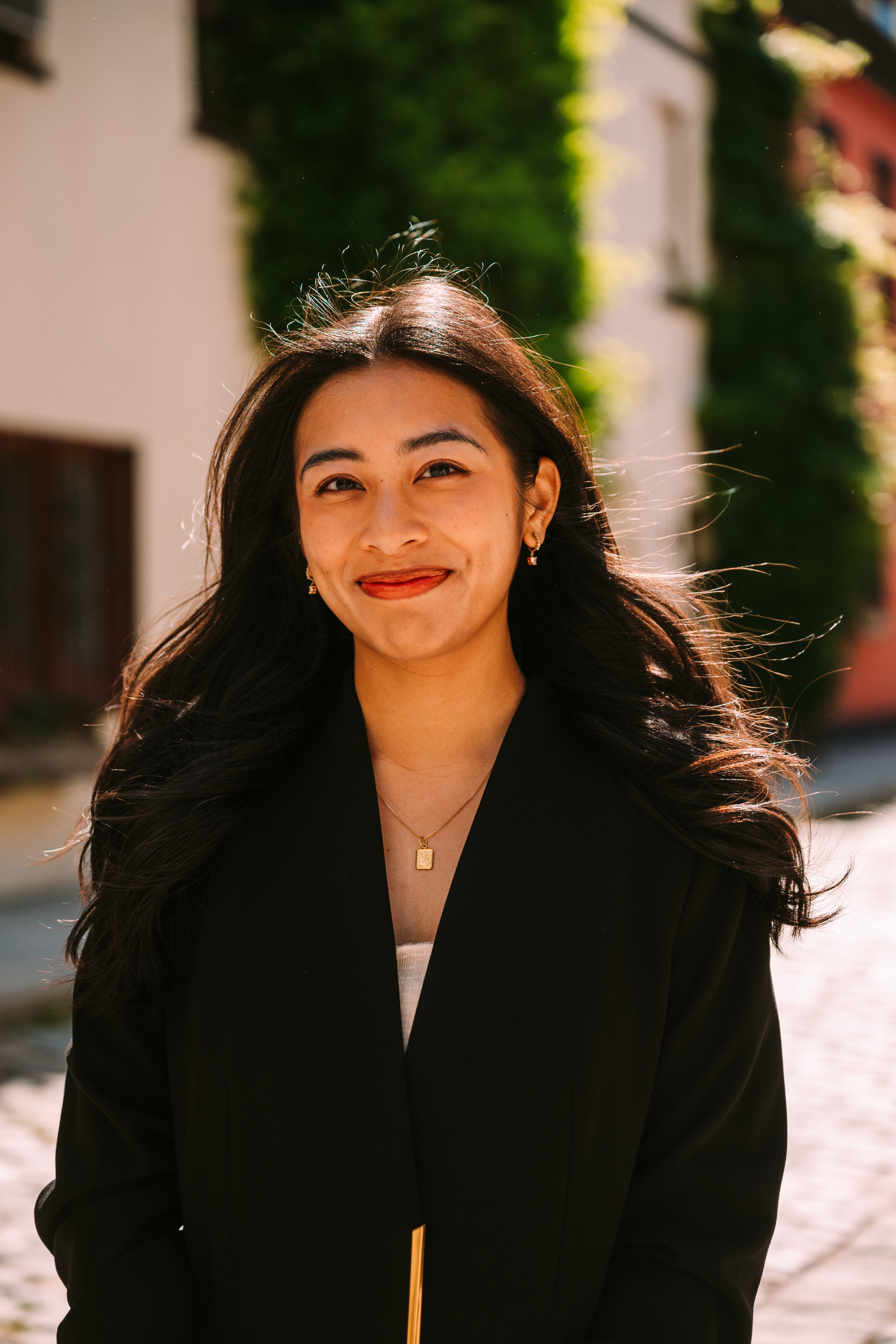 A photo of a filipino-american young professional with long brown hair.